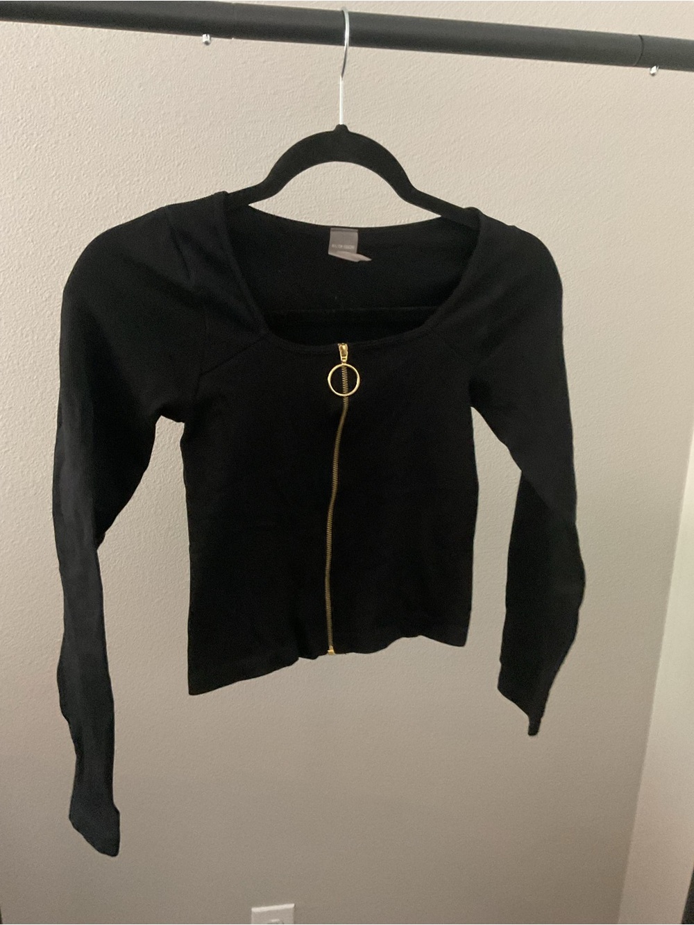 Black Long-Sleeve Zip-Front Women's Top with Gold Ring Pull